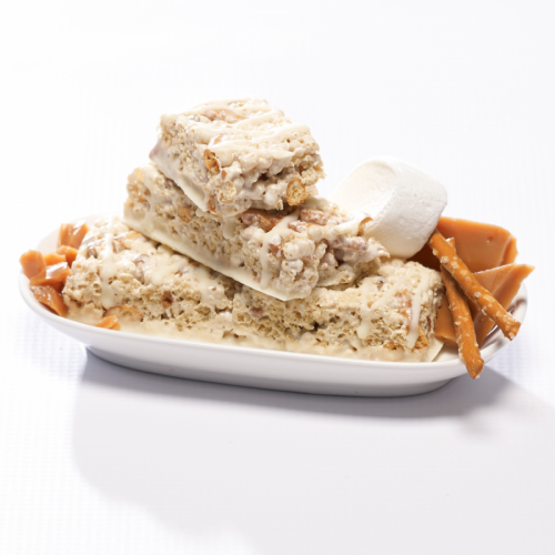 Salted toffee pretzel crisp protein bars with caramel marshmallow and pretzel pieces on a plate. Metabolic Web Store MRC protein bars