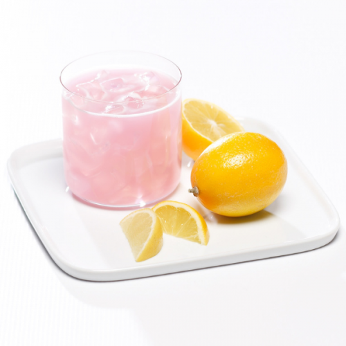 Metabolic Web Store MRC Pink Lemonade protein drink in a glass with whole, halved, and sliced lemons