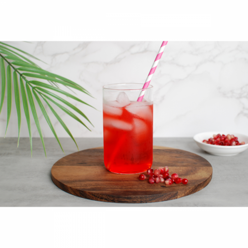 Metabolic Web Store MRC Pomegranate protein drink in a clear glass with pink spiral straw and pomegranate seeds in a bowl